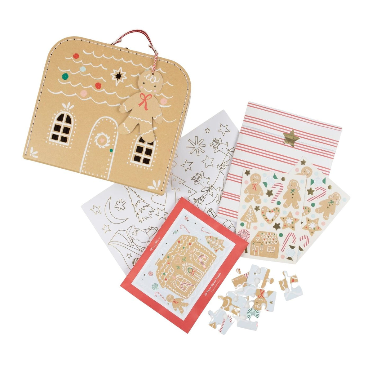 A gingerbread-themed craft kit or coloring set displayed on a white background, including a tan house-shaped case with a hanging loop, several printed sheets with gingerbread illustrations, striped paper, and small cutout pieces.