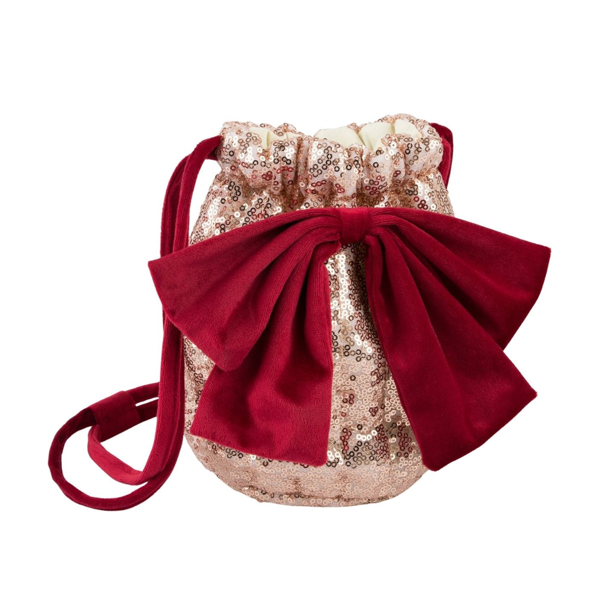 A small drawstring bag with a large red velvet bow, featuring a champagne gold sequined body and a matching red shoulder strap, shown on a plain white background.