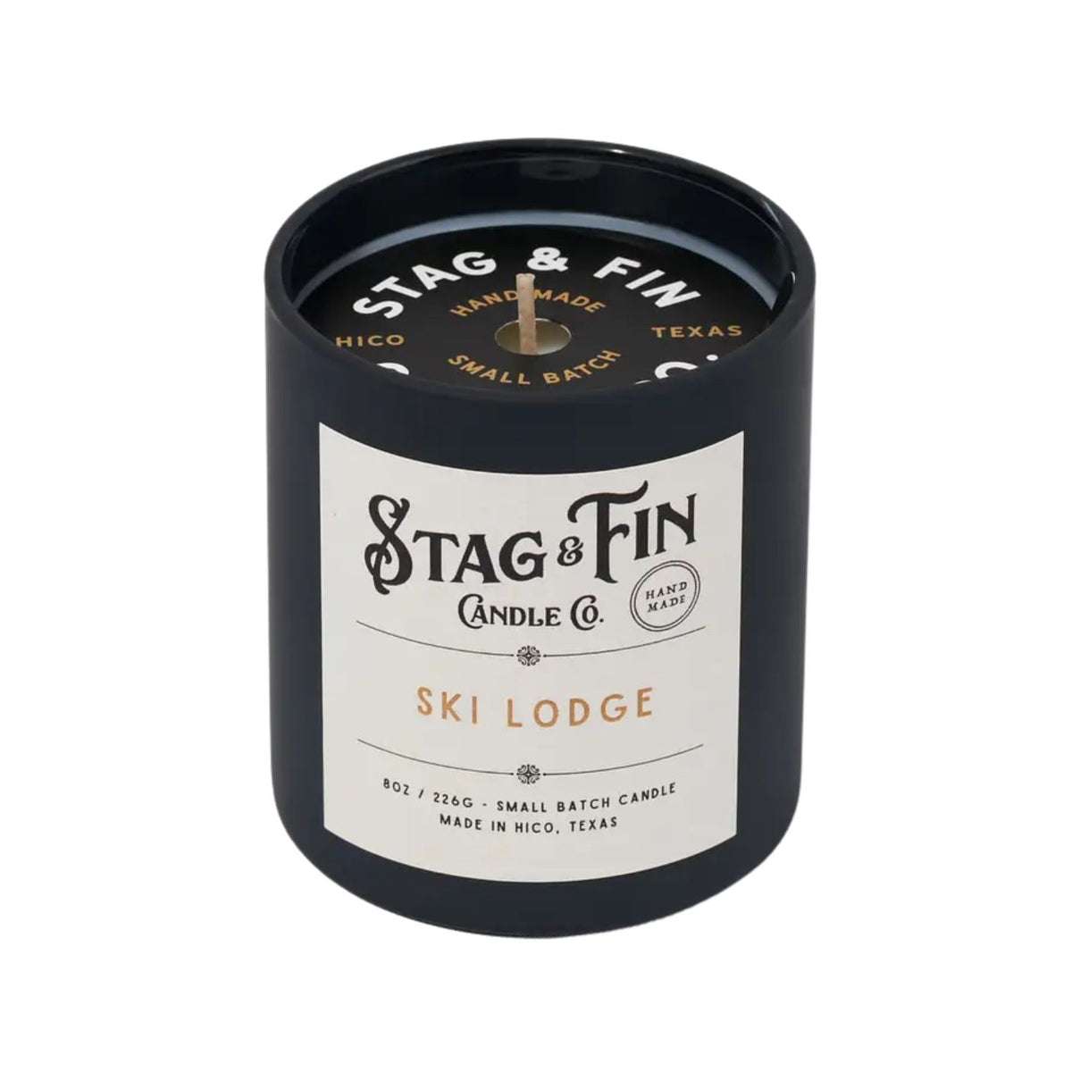 Stag & Fin candle with label on a white background