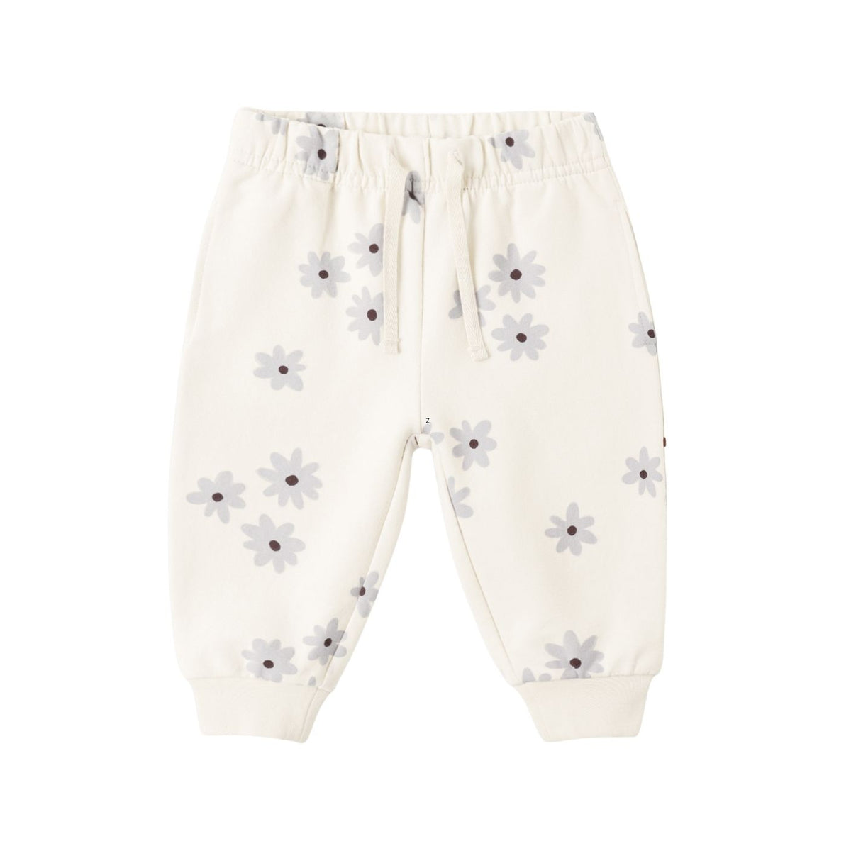 Off-white baby jogger pants with a small gray and purple daisy print, featuring an elastic waistband with a drawstring and ribbed ankle cuffs.