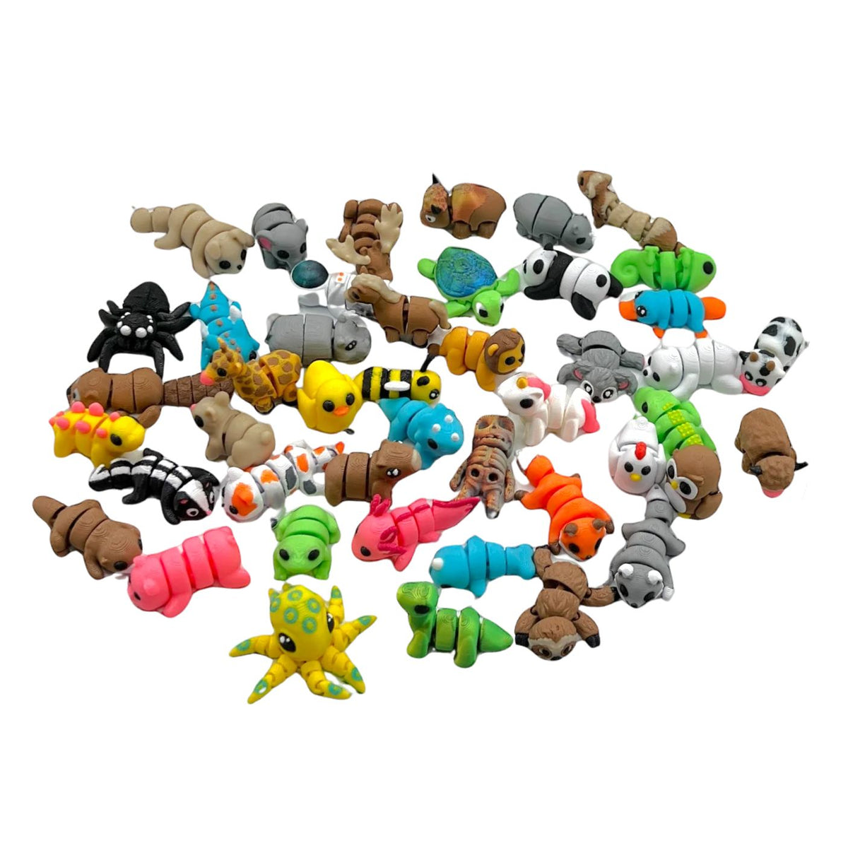 A collection of small, colorful animal-shaped craft figures or beads arranged in a loose pile on a plain white background. The figures include various animal designs such as a cat, dog, spider, butterfly, turtle, fish, and starfish in multiple bright colors.
