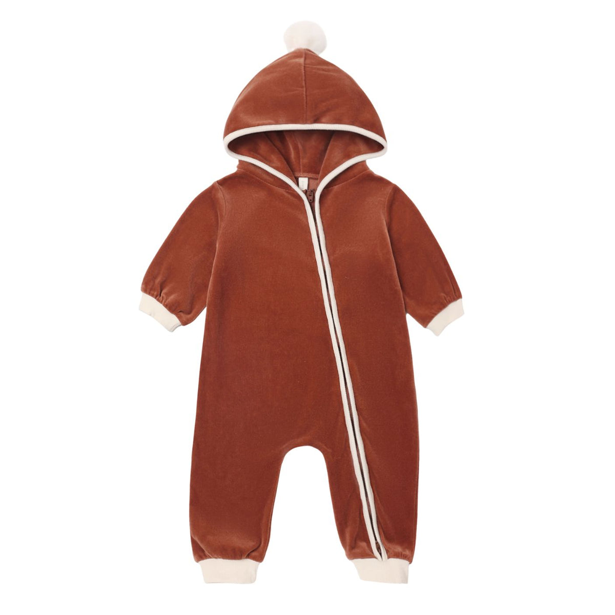 Front view of a plush, long-sleeve hooded fleece jumpsuit in a rich redwood brown hue, featuring a diagonal front zipper, cream-colored ribbed cuffs at the wrists and ankles, and a small pom-pom on top of the hood.