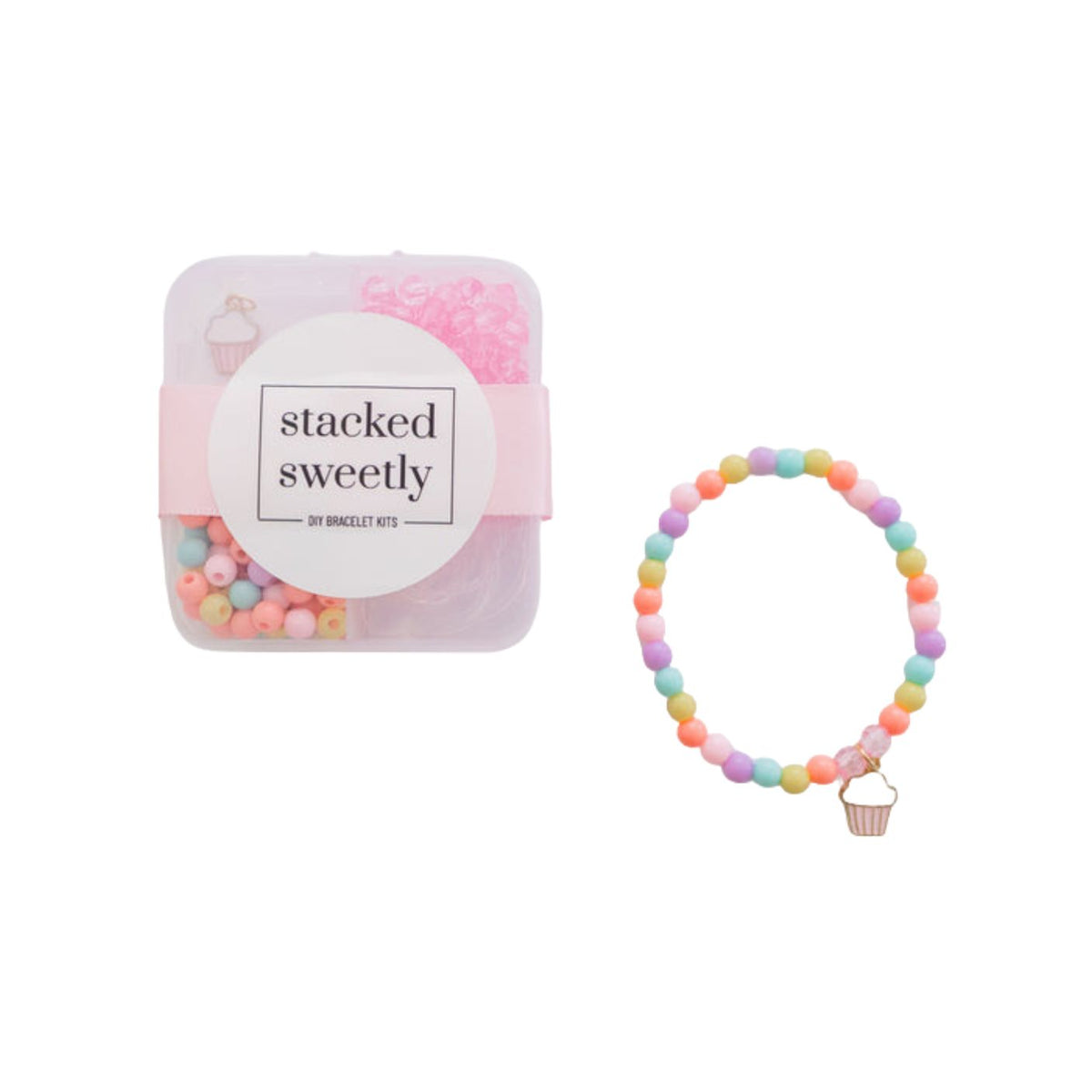 A clear product photo of the Sweet Treat DIY Mini Bracelet Kit, featuring a sectioned plastic storage container filled with colorful pastel beads and a small cupcake charm, alongside a finished pastel-beaded stretch bracelet with a matching cupcake charm on a white background.