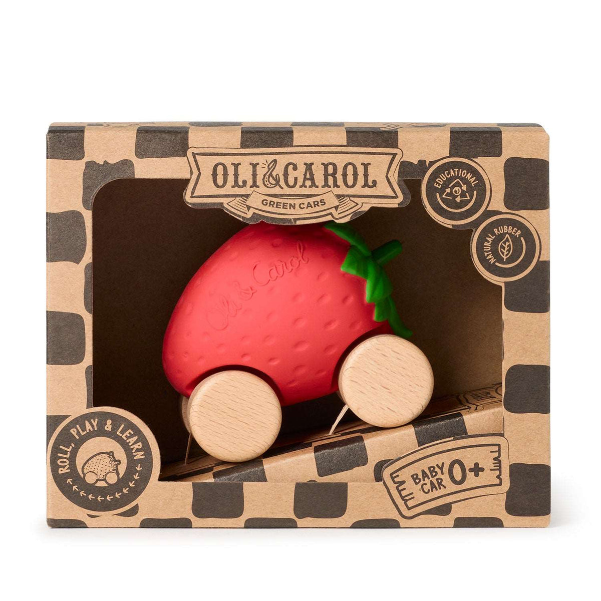 A strawberry-shaped wooden toy car in its retail packaging, featuring a red strawberry body with a green leafy top and natural wood wheels, displayed inside a brown patterned box labeled Olli & Carol.