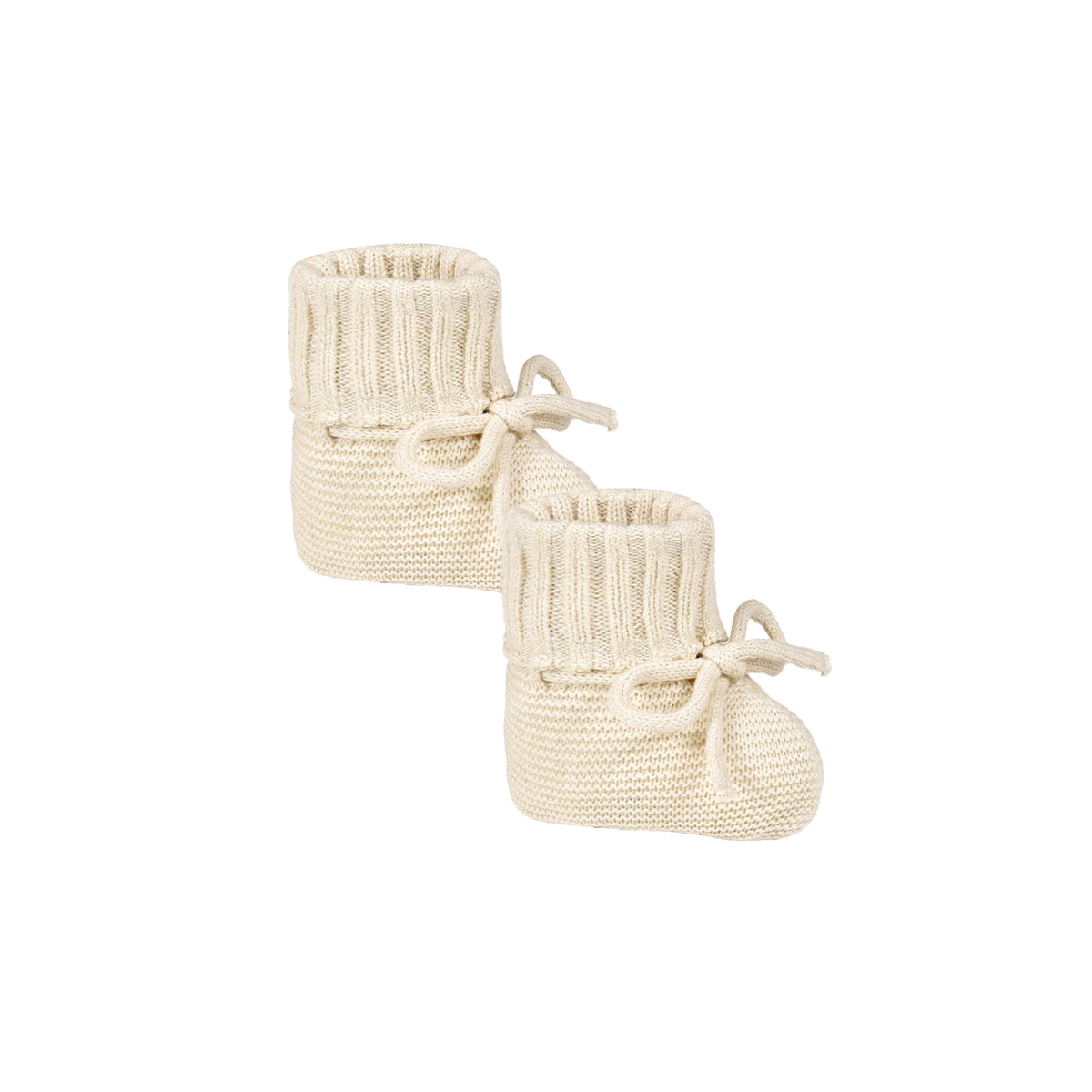 Pair of cream knitted baby booties on a white background