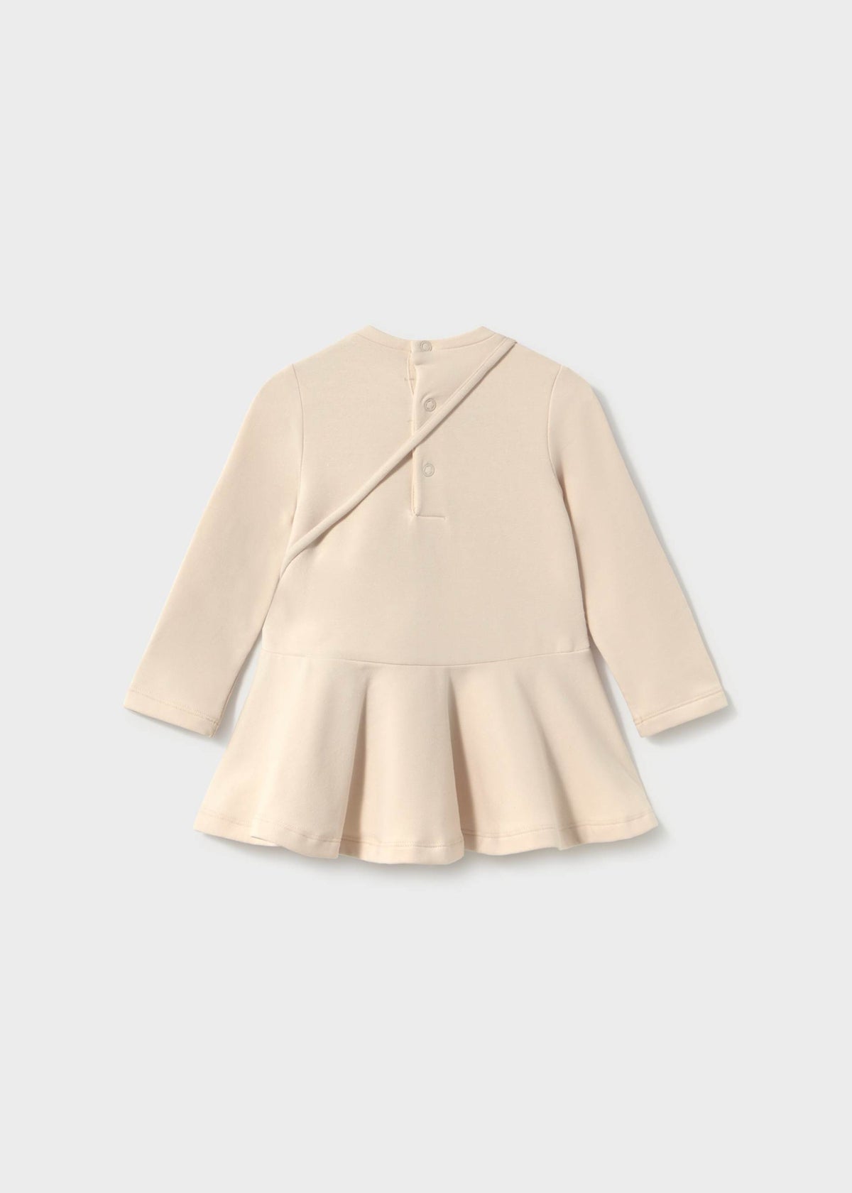 Beige peplum top on a light gray background