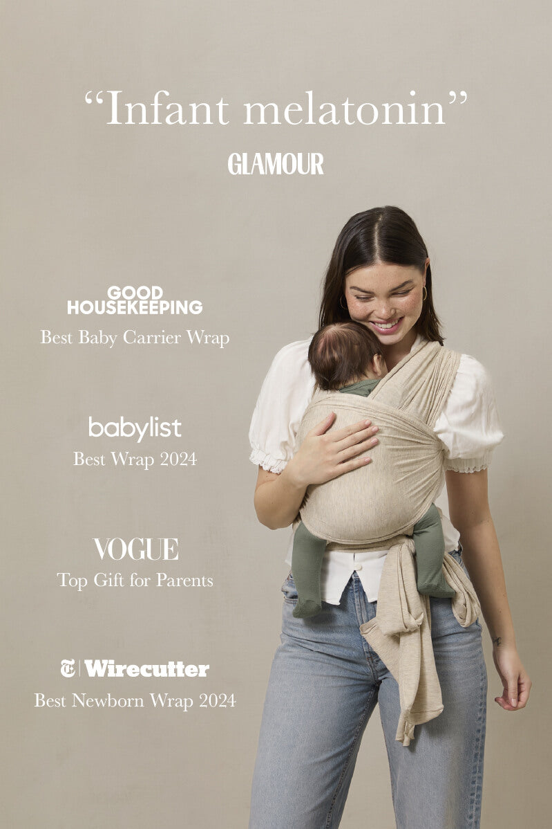 Woman holding a baby in a carrier wrap with accolades listed on a beige background