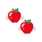 Two red apple-shaped hair clips with green leaves on a white background