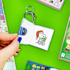 Keychain with a cartoon character on a green background