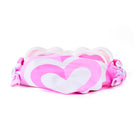Pink and white hair tie with heart design on a white background