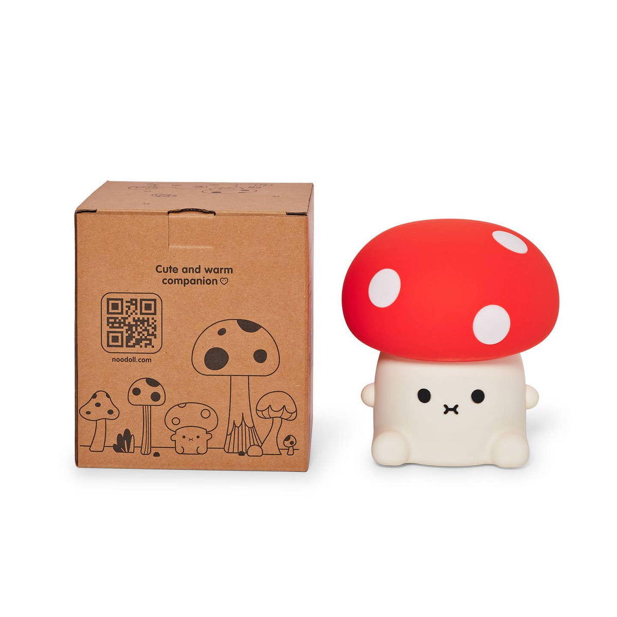 Cute mushroom-shaped toy with red cap and white spots next to its packaging box on a white background.