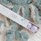 Box of bath bombs with a textured blanket background