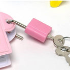 Pink lock with keys on a white background