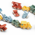 Set of colorful toy trucks on a white background