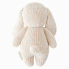 Knitted bunny toy on a white background