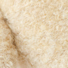 Close-up of beige wool fibers