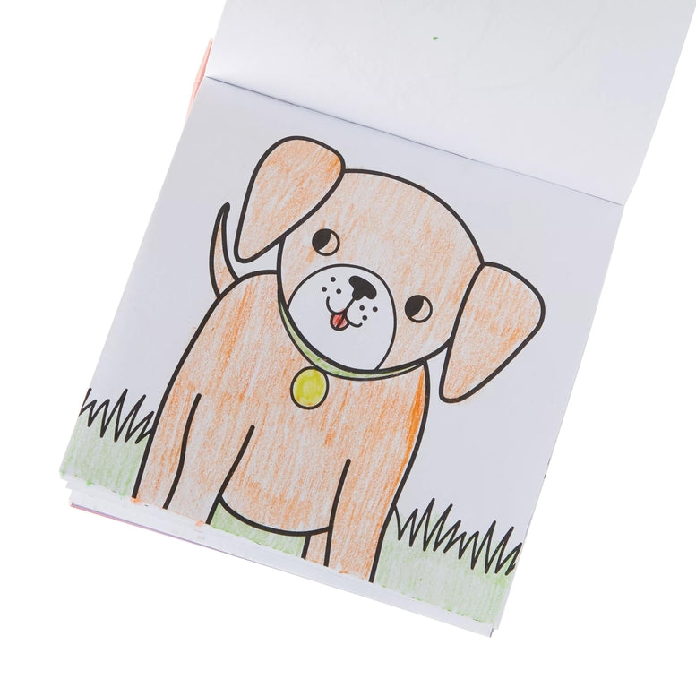 A child's colored pencil sketch of a cute puppy on a white page, shown from an angled overhead view against a white background.