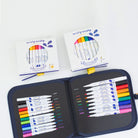 Set of colorful markers in a case with packaging on a white background