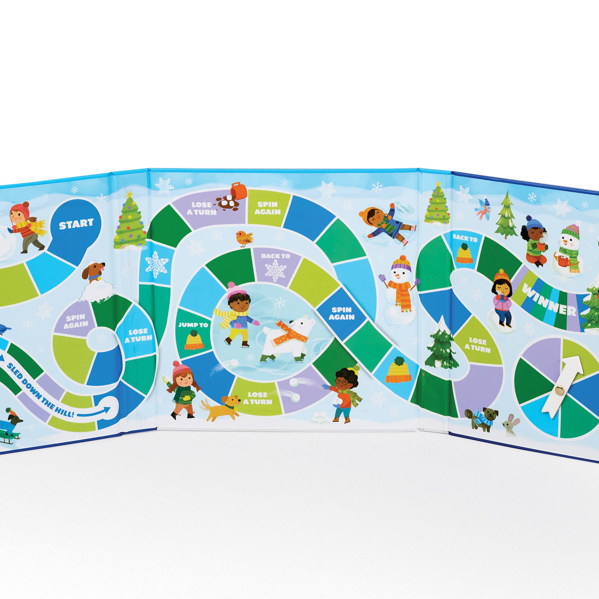 A colorful winter-themed board game spread out on a white surface. The game board features illustrated children, snow, trees, and seasonal icons, with sections labeled Start, Log a Story, Spin Again, Lose a Turn, Win a Turn, and Winter.