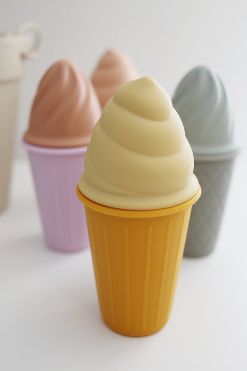 Set of colorful silicone ice cream cones  on a light background
