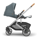 Gray and black stroller with a white background