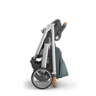 Folded stroller with a carrying bag on a white background