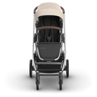 Stroller with beige canopy on a white background