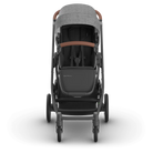 Gray and black stroller with brown accents on a white background