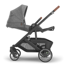 Gray and black stroller on a white background