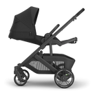 Black baby stroller on a white background