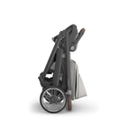 Folded stroller on a white background