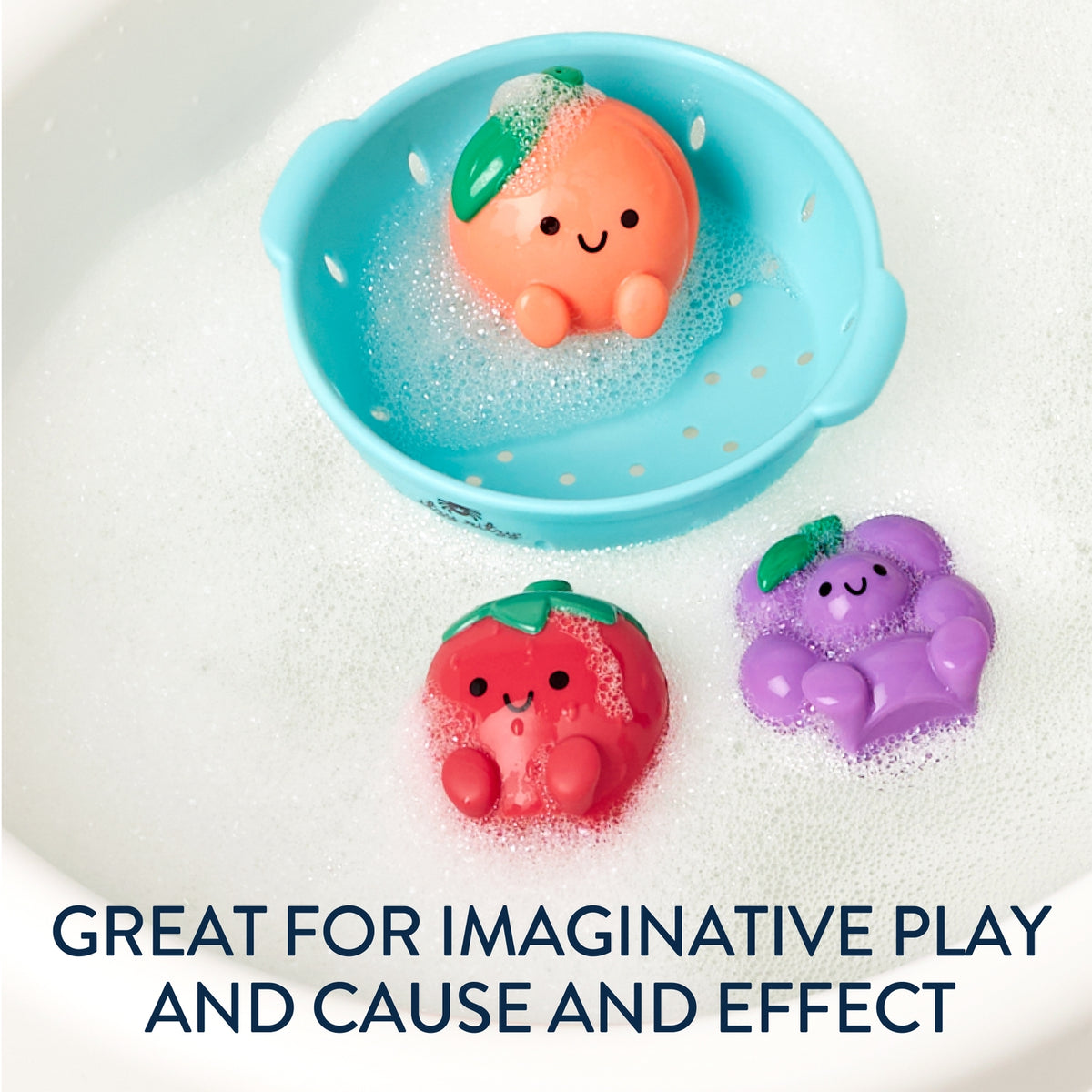 Fruit-shaped bath toys with a blue bowl on a white surface with text 'Great for imaginative play and cause and effect'.