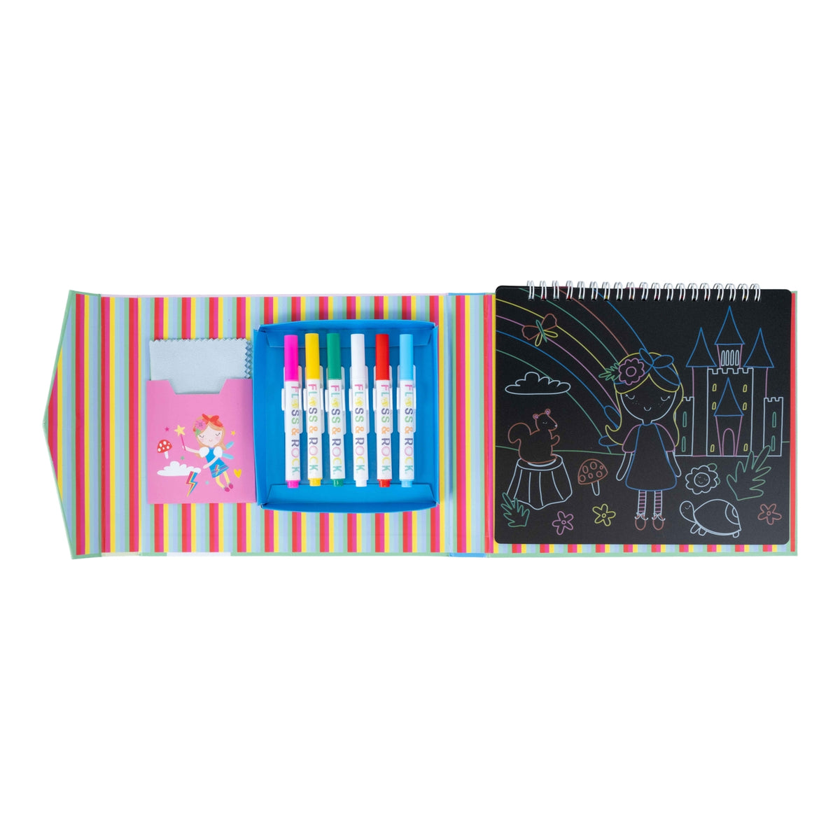 Children's art set with markers, crayons, and drawing book on a striped background