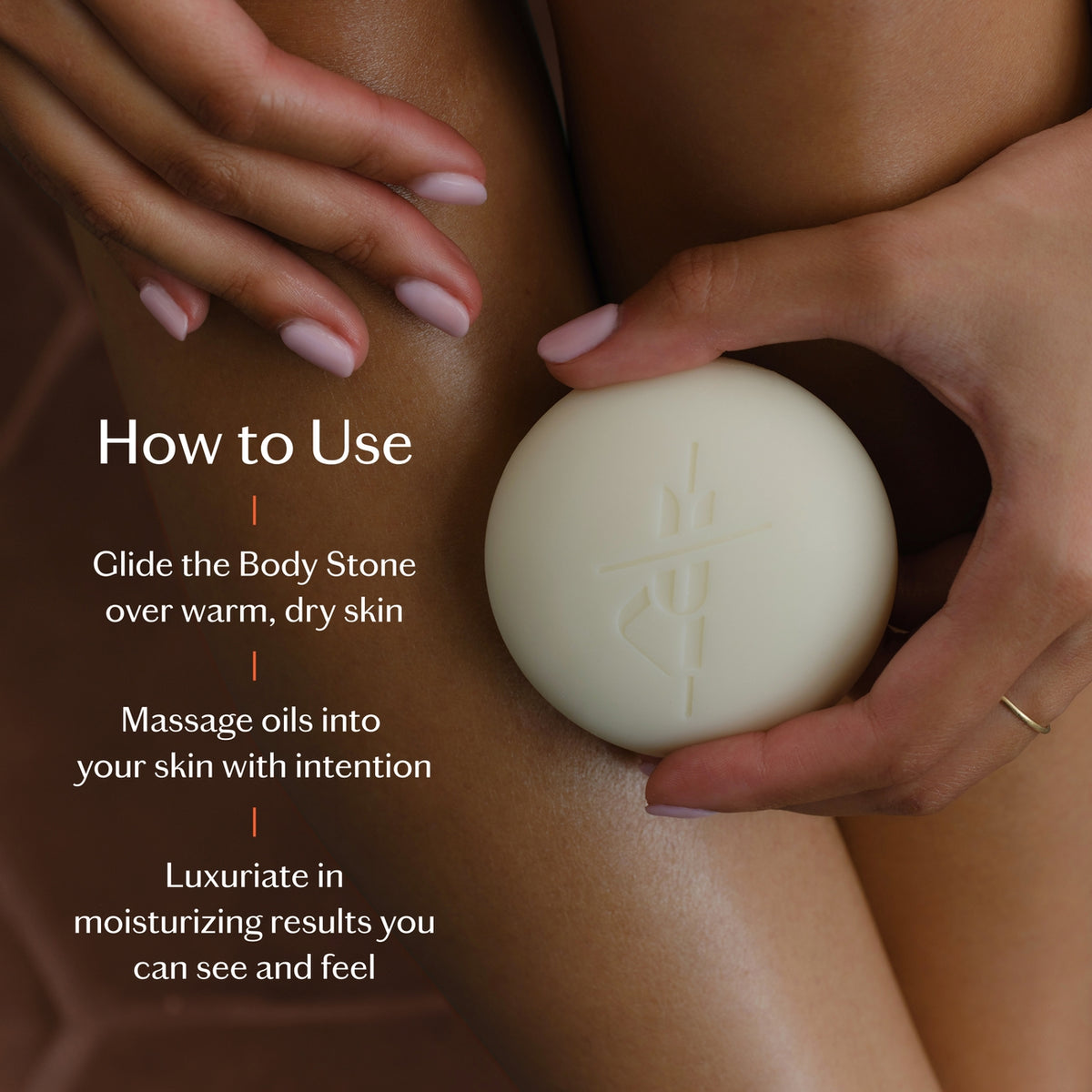 Person holding a white body stone with text on how to use it.