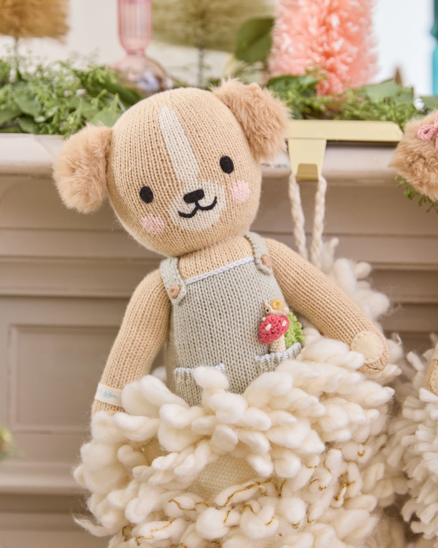 A teddy bear on a Christmas decorations.