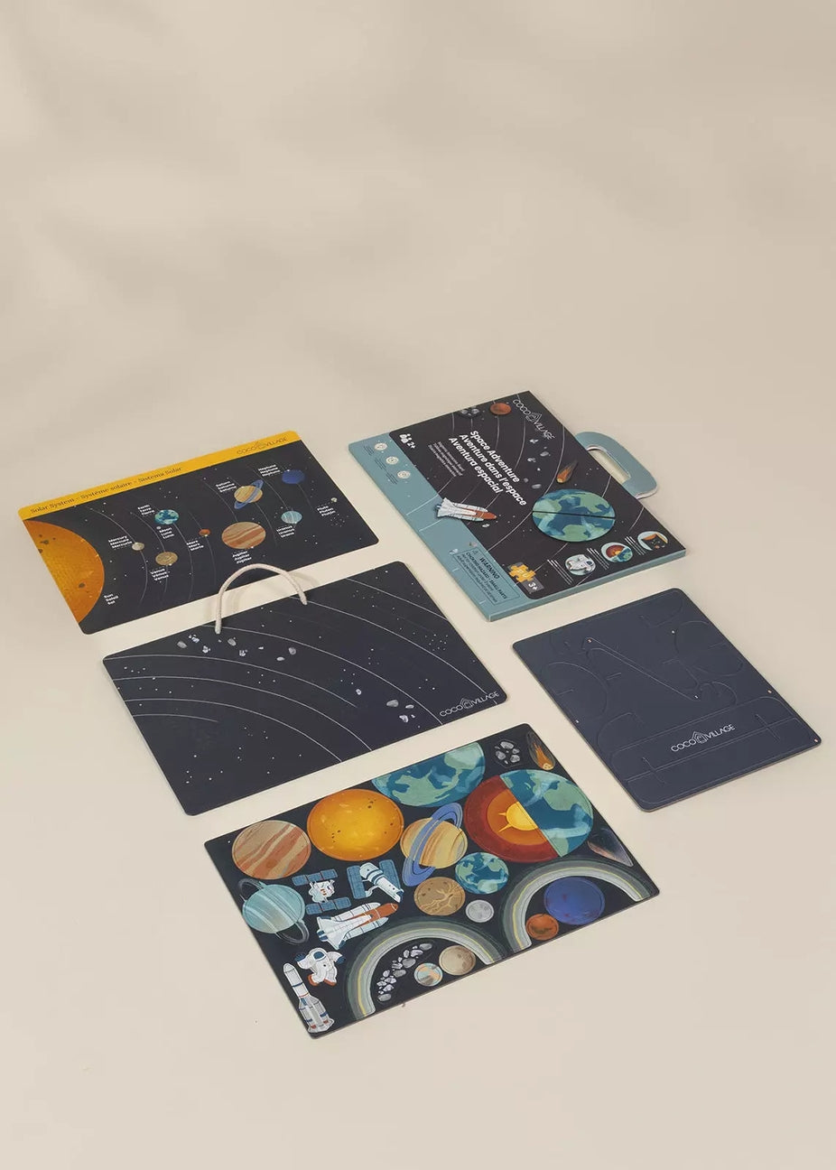 Set of space-themed notebooks and planners on a beige background