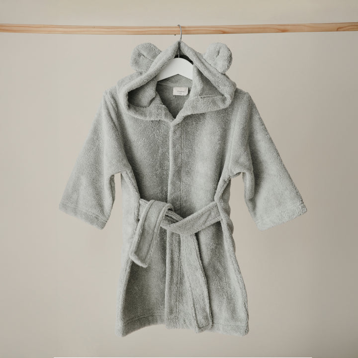 Gray hooded robe with a belt on a beige background