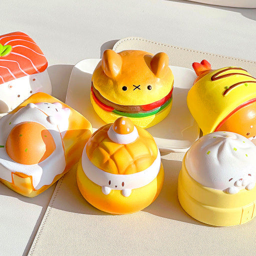 Set of cute food-themed squishies against a light background.