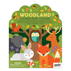 Packaging of a 'Woodland' coloring book and stickers set with forest animals on a green background.