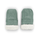 A pair of green knit baby booties with white sherpa lining, shown from the top on a white background.