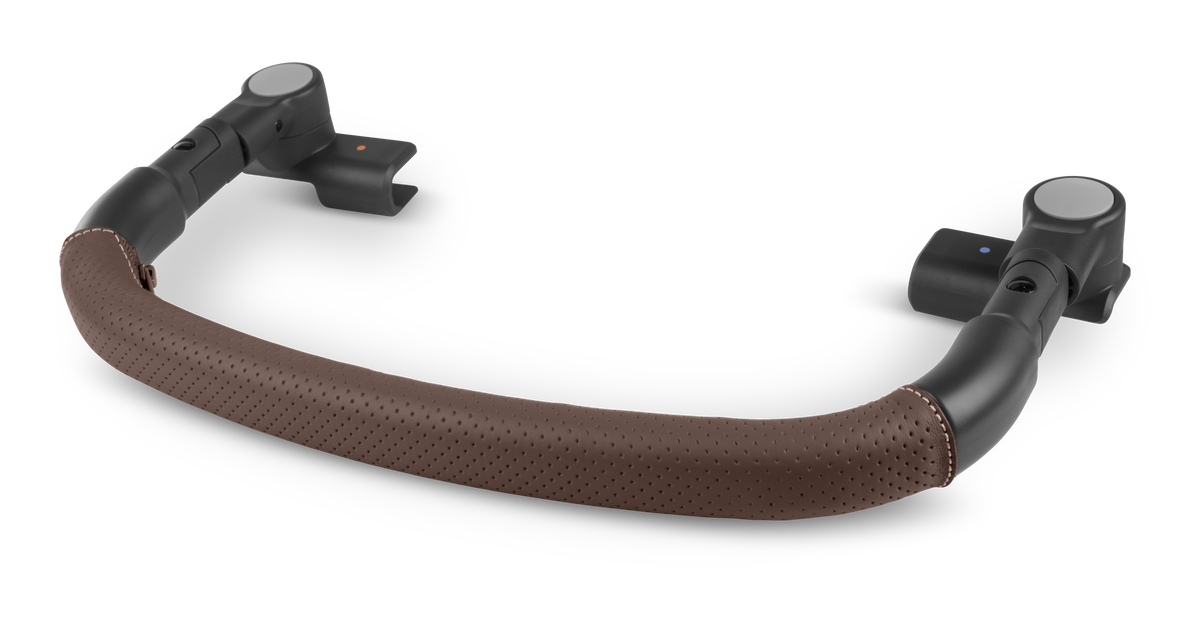 A curved baby carrier handlebar with a brown perforated faux-leather grip and black plastic mounting arms, shown on a solid white background.