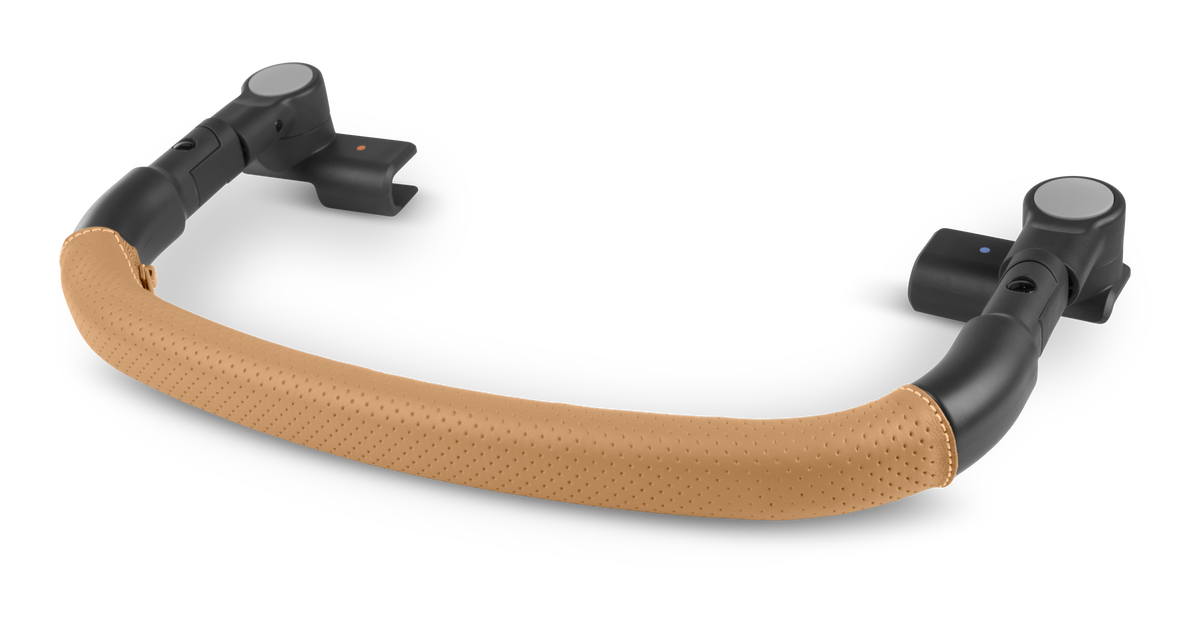 A curved baby carrier handlebar with a tan perforated faux-leather grip and black plastic ends, shown on a clean white background.