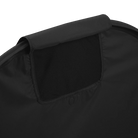 A close-up view of the peek-a-boo mesh opening on the black room-darkening canopy for the UPPAbaby Remi V2 playard against a dark checkered background.