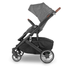 Black and gray stroller on a white background