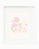 A framed art print featuring a watercolor illustration of a teddy bear surrounded by soft pink and purple flowers on a cream background, enclosed in a white frame.