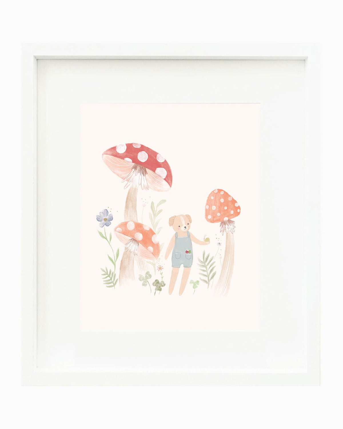 A framed children's art print featuring a cute illustration of a little girl in blue overalls standing among red and orange mushrooms and small flowers, presented in a white frame against a white background.