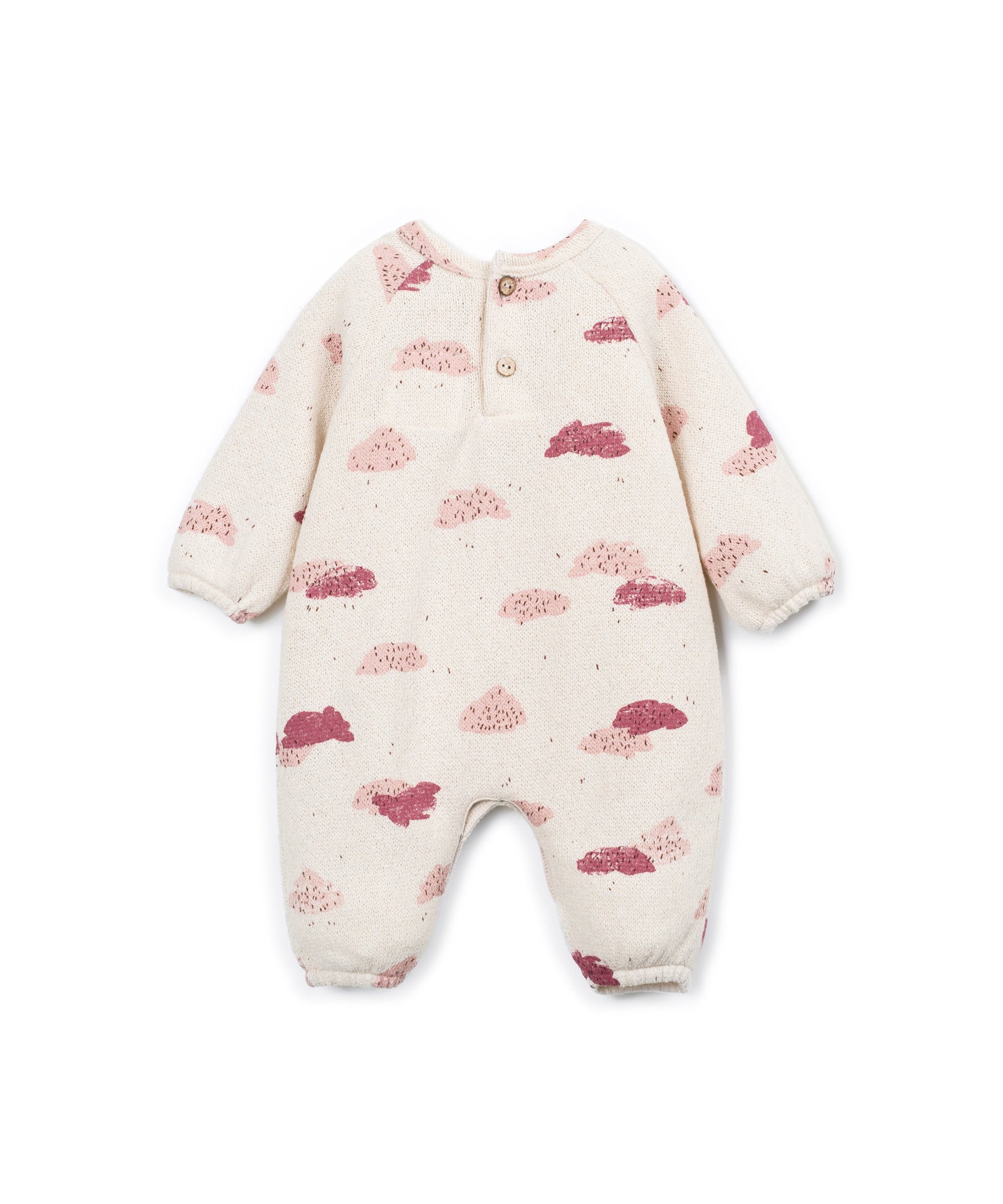 A baby long-sleeve footless one-piece romper in cream-colored fabric with a scattered pink and dusty rose cloud pattern, featuring a three-button snap closure at the collar.