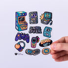 Collection of colorful retro-themed stickers on a white background with a hand holding one sticker.