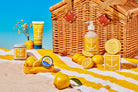 Beach-themed products including a picnic basket, lemons, and beach towels with a clear blue sky.