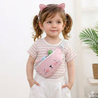 Child wearing a pink fanny pack with cat design and cat ears headband.